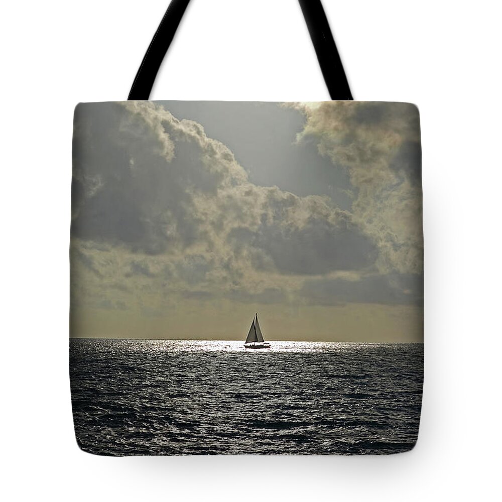 Naples Tote Bag featuring the photograph In the spotlight. Sailboat sailing in Naples Fl by Toby McGuire