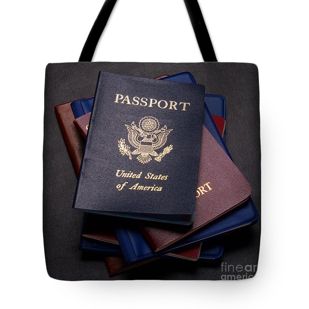 Passports Tote Bag featuring the photograph International Passports by Olivier Le Queinec
