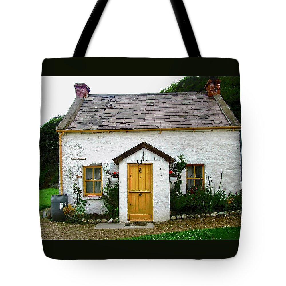 Cottage Tote Bag featuring the photograph Irish Cottage with a yellow door by Stephanie Moore
