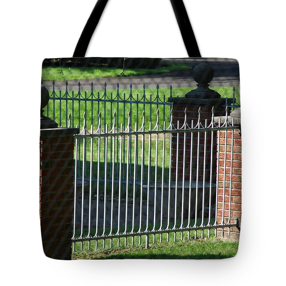 Fencing Tote Bag featuring the photograph Iron And Brick Fencing by Ee Photography