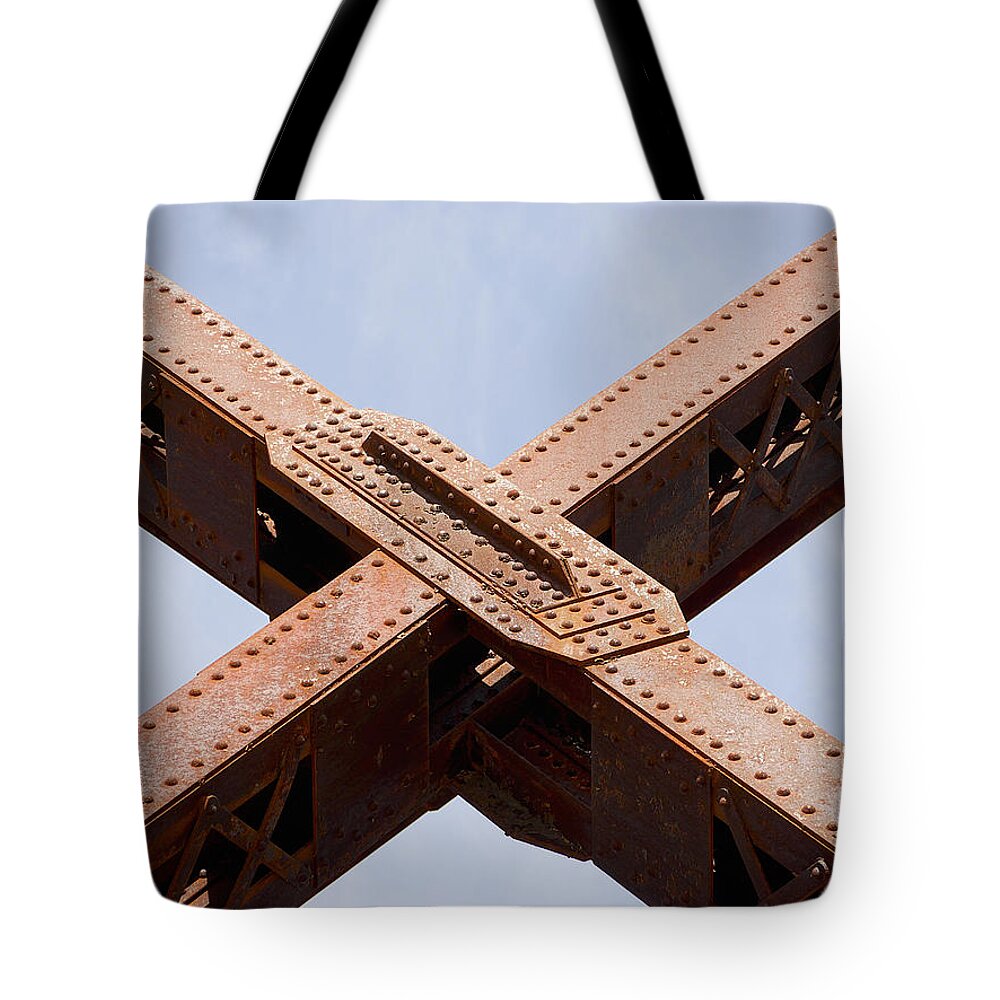Richard Reeve Tote Bag featuring the photograph Iron Kiss by Richard Reeve