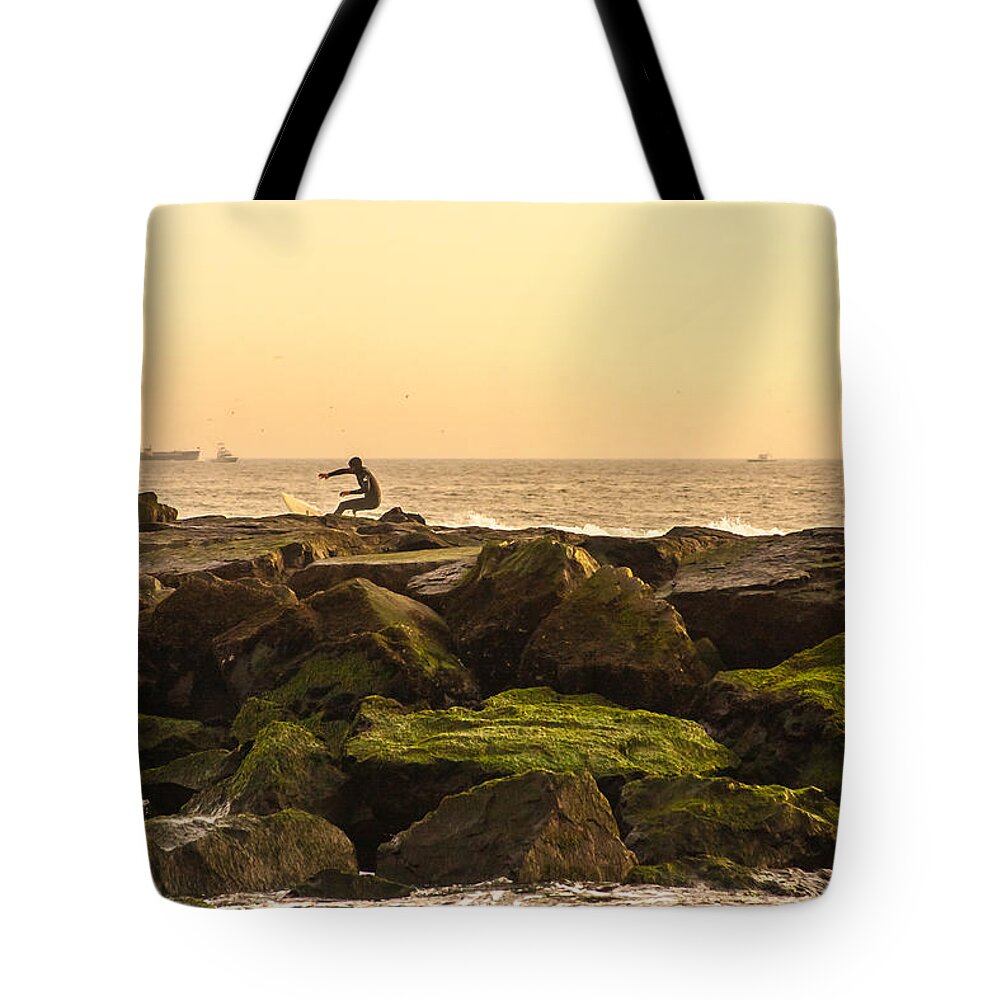 Surfer Tote Bag featuring the photograph Jetty Surfer by Kathleen McGinley