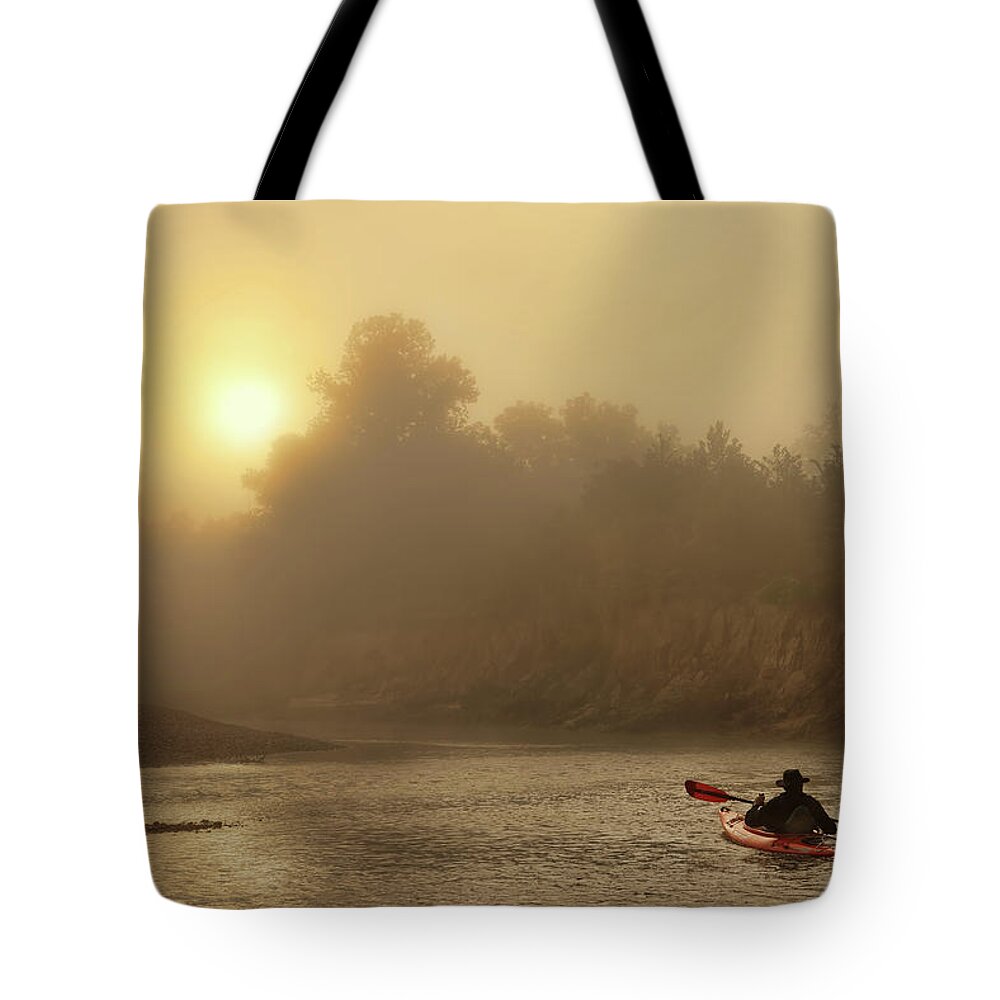 Fog Tote Bag featuring the photograph Journey on the foggy river. by Robert Charity