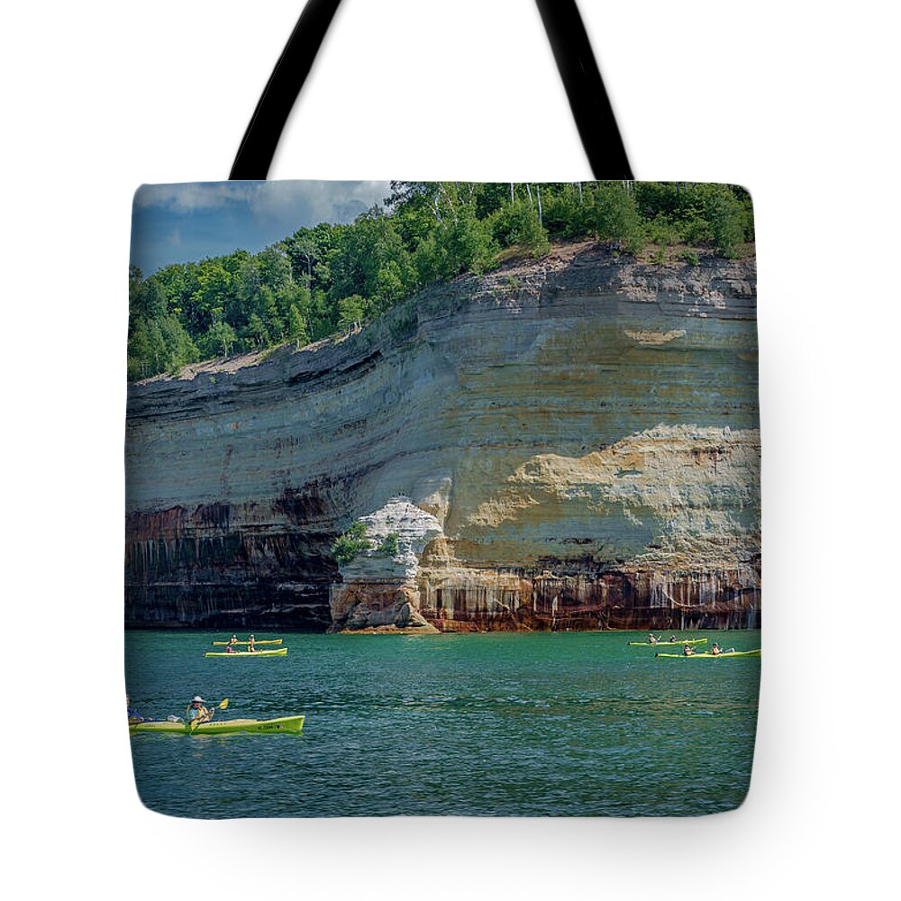 Pictured Rocks National Lakeshore Tote Bag featuring the photograph Kayaking the Pictured Rocks by Gary McCormick