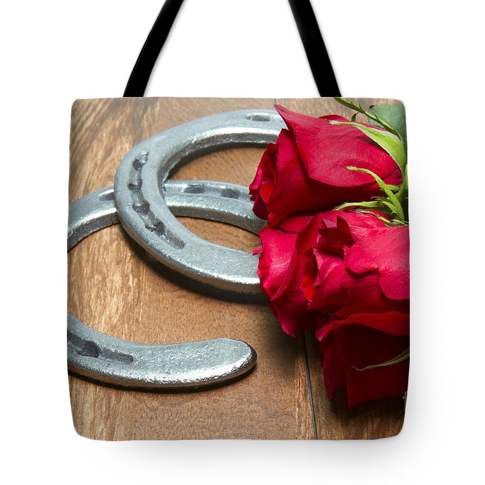 Kentucky Derby Tote Bag featuring the photograph Kentucky Derby Red Roses with Horseshoes on Wood by Karen Foley