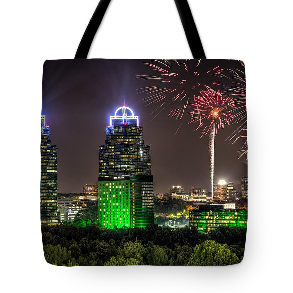Sandy Springs Tote Bag featuring the photograph King And Queen Buildings Fireworks by Anna Rumiantseva