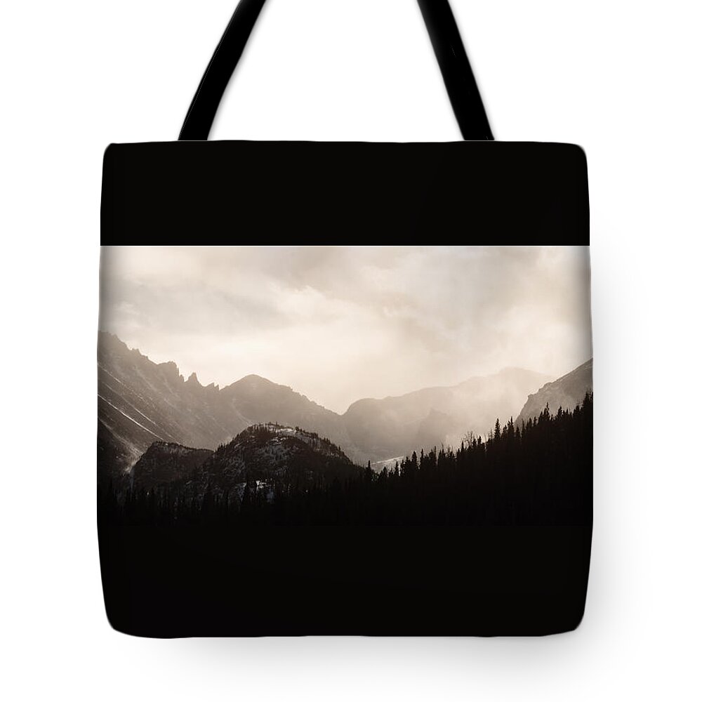 Longs Peak Tote Bag featuring the photograph King of the Light by Carlos Flores
