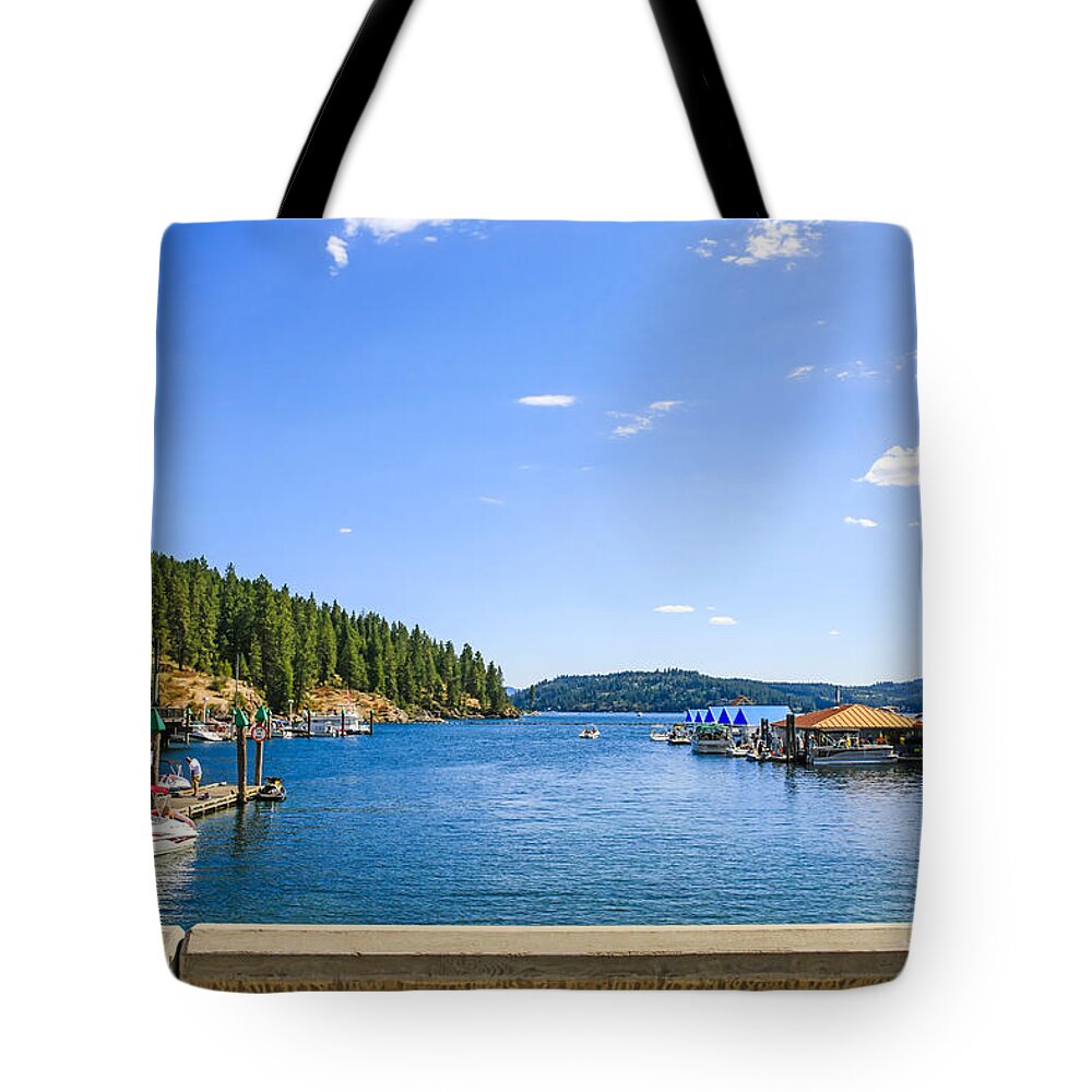 Boats; Lake; Resort; Coeur; D'alene; Idaho; Id; Scenery; Shoreline; Backdrop; Landscape; Seascape; Setting; Spectacle; Vista; View; Panorama; Scene; Setting; Terrain; Location; Outlook; Sight; Travel; Tourism; Tourist; Destination; Holiday; Vacation; Summer; Sightsee; Sights; Landmarks; Location; Popular; Places; Attraction; Visiting; Adventure; Tour; Exploring; America; Usa Tote Bag featuring the photograph Lake Coeur d'Alene Idaho by Chris Smith