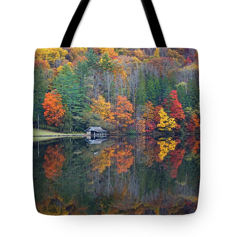 Fall Scene Tote Bag featuring the photograph Lake Logan Boathouse in Fall by Mike McGlothlen