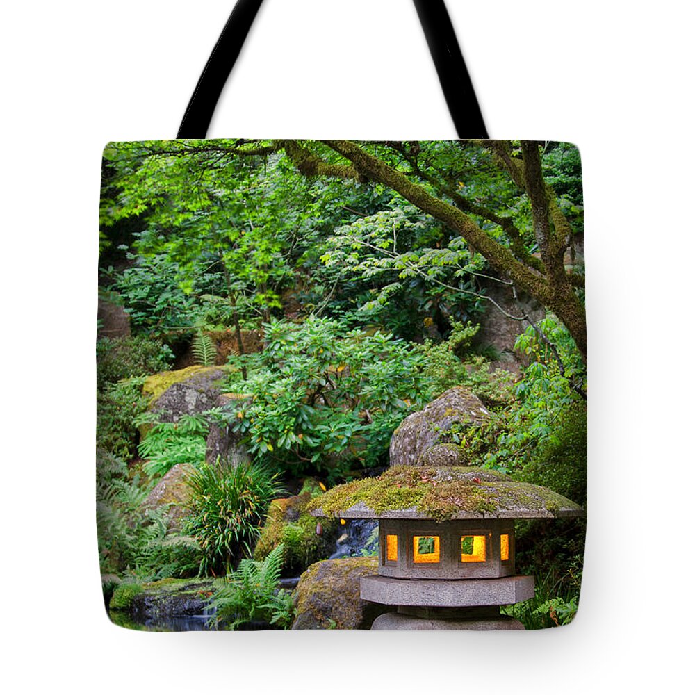Garden Tote Bag featuring the photograph Lantern Aglow by Don Schwartz