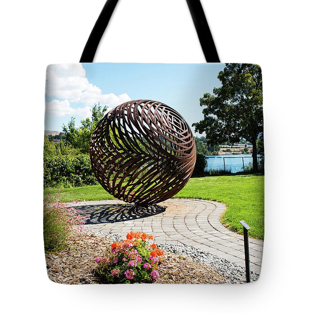 Columbia River Tote Bag featuring the photograph Latticed Iron Ball with Shadow by Tom Cochran