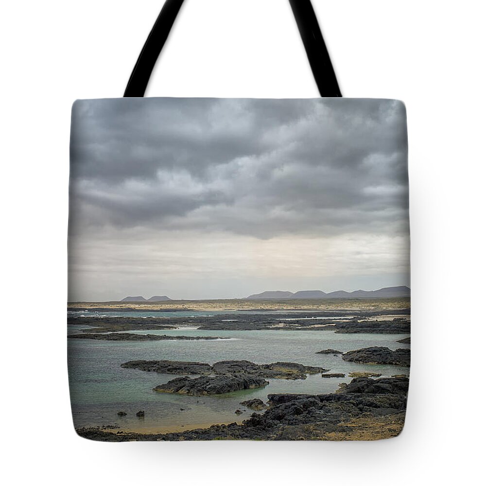 Fuerteventura Tote Bag featuring the photograph Lava coast and ocean by Patricia Hofmeester