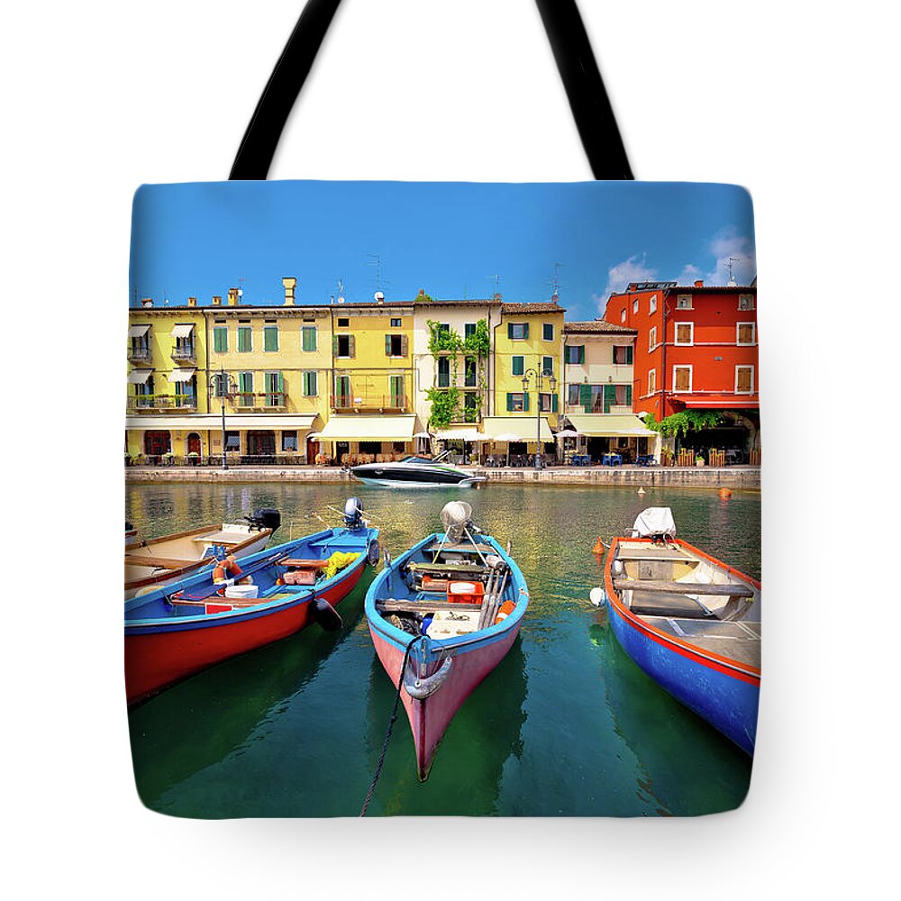 Lazise Tote Bag featuring the photograph Lazise colorful harbor and boats view by Brch Photography