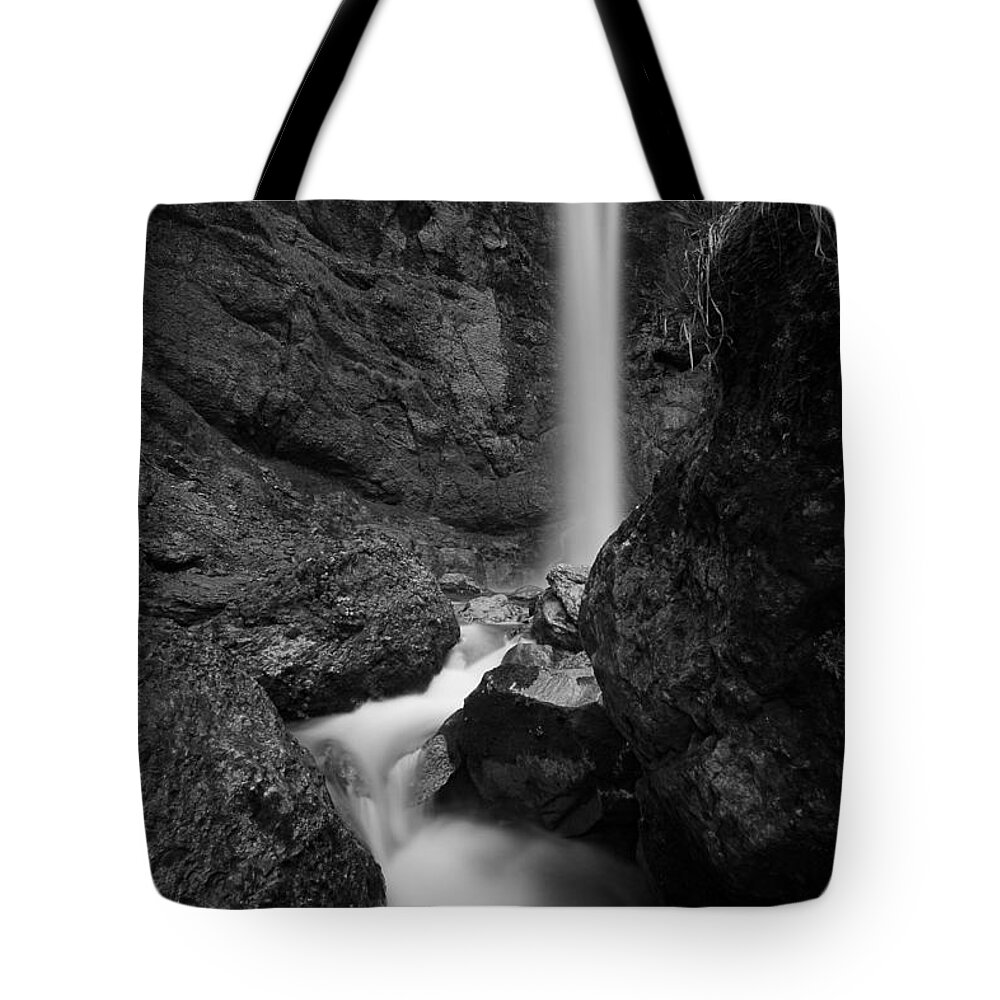 Leuenfall Tote Bag featuring the photograph Leuenfall in black and white by Andreas Levi