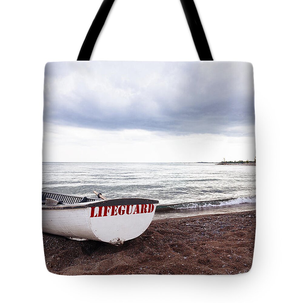 Toronto Tote Bag featuring the photograph Lifeguard Boat on Toronto Beach by Laura Tucker