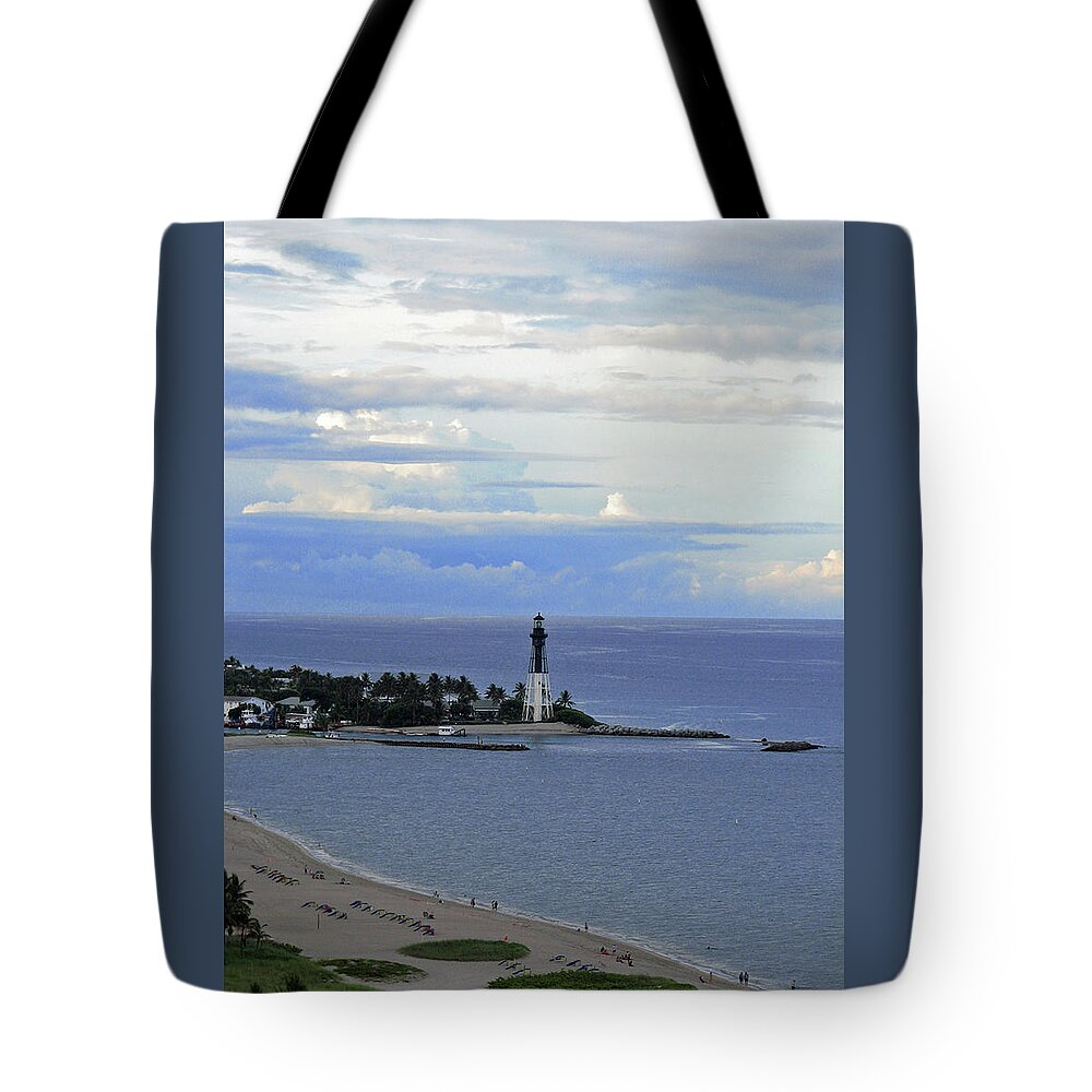 Lighthouse Tote Bag featuring the photograph Lighthouse and Light Blue by Corinne Carroll