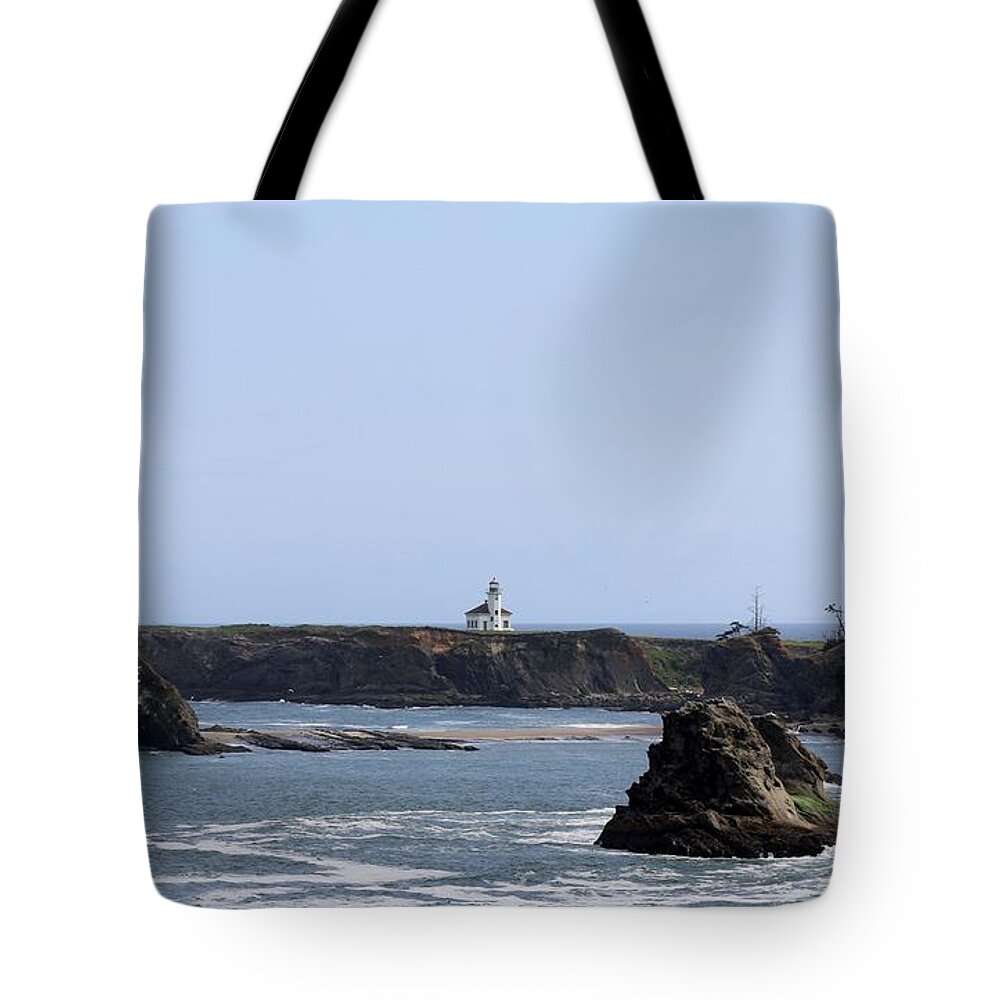Lighthouse Tote Bag featuring the photograph Lighthouse on the Oregon Coast by Christy Pooschke