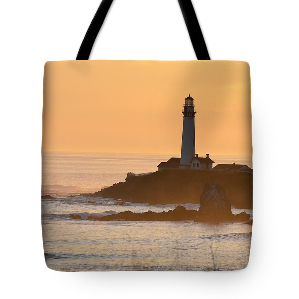 Lighthouse Tote Bag featuring the photograph Lighthouse At Sunset by Alex King