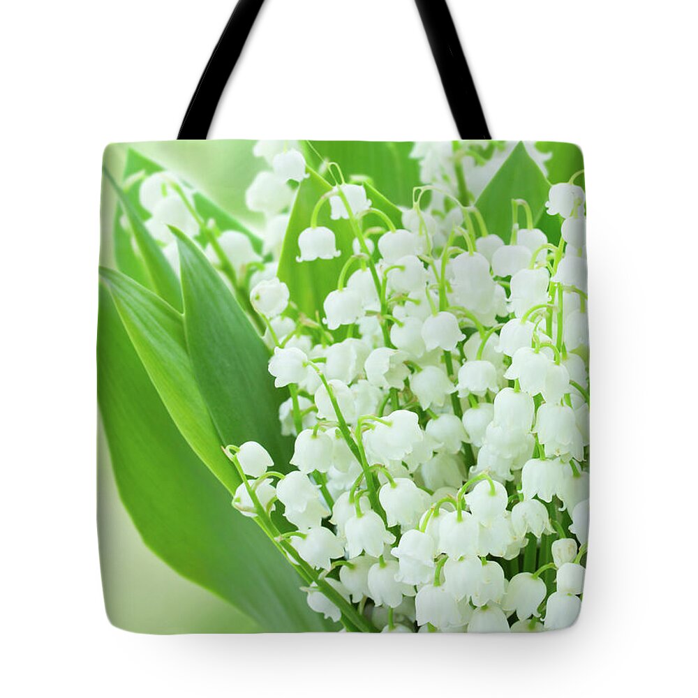 Lilly Tote Bag featuring the photograph Lilly of the Valley Flowers Close up by Anastasy Yarmolovich