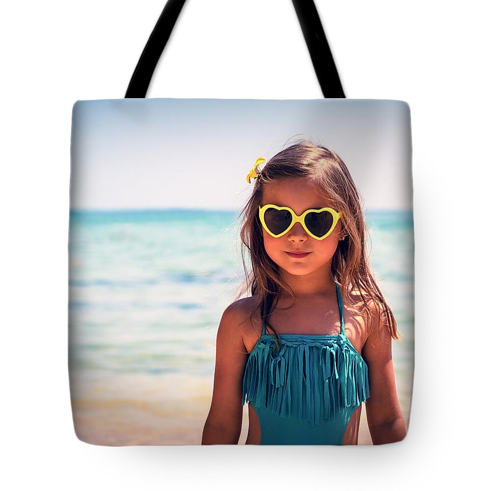 Activity Tote Bag featuring the photograph Little girl on the beach by Anna Om