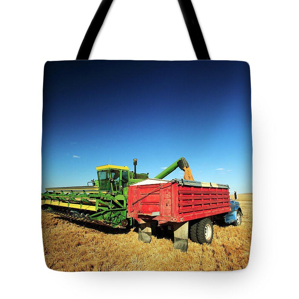 Combine Tote Bag featuring the photograph Load of Wheat by Todd Klassy