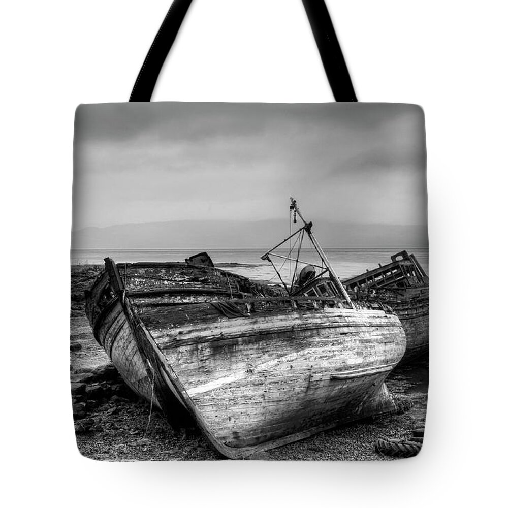 Isle Of Mull Tote Bag featuring the photograph Lonely fishing boats by Michalakis Ppalis
