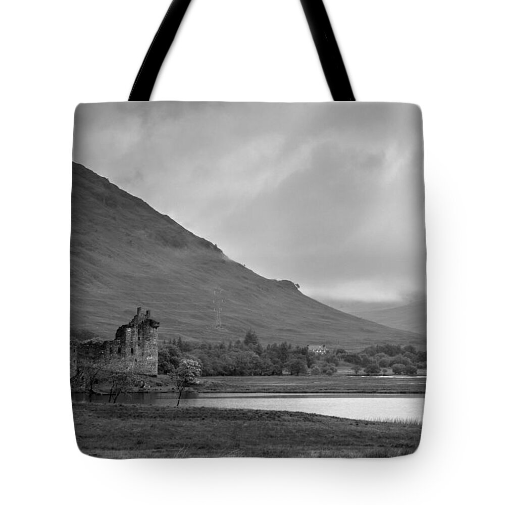 Kilchurn Castle Tote Bag featuring the photograph Lonely in grey by Chris Whittle