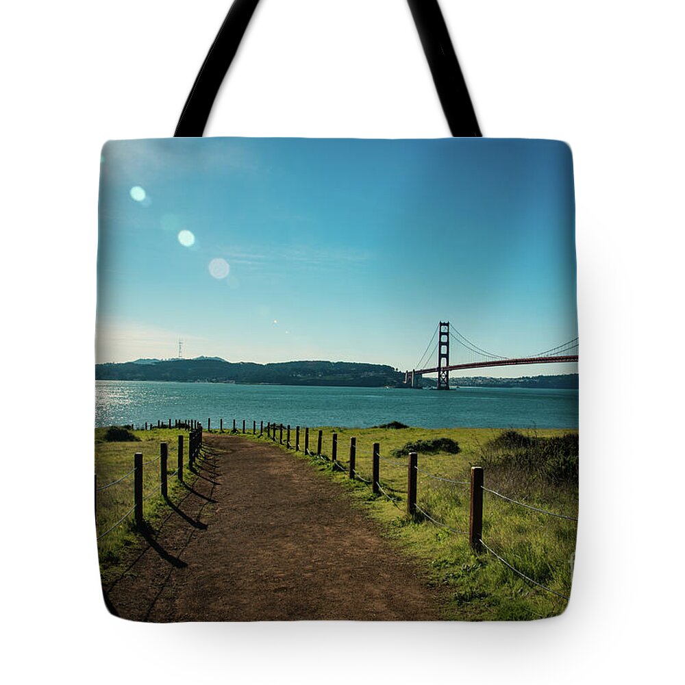 Bridge Tote Bag featuring the photograph Lonely path with the golden gate bridge in the background by Amanda Mohler