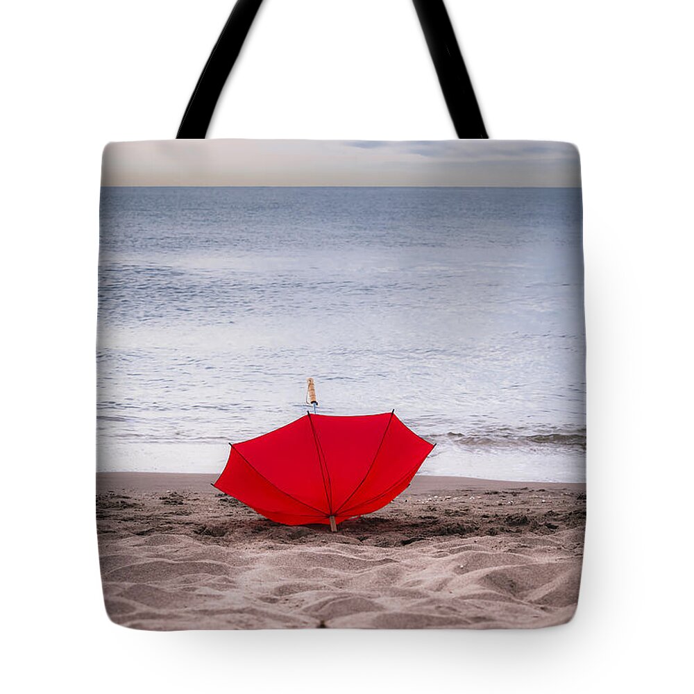 Abstract Tote Bag featuring the photograph Lost umbrella by Maria Heyens