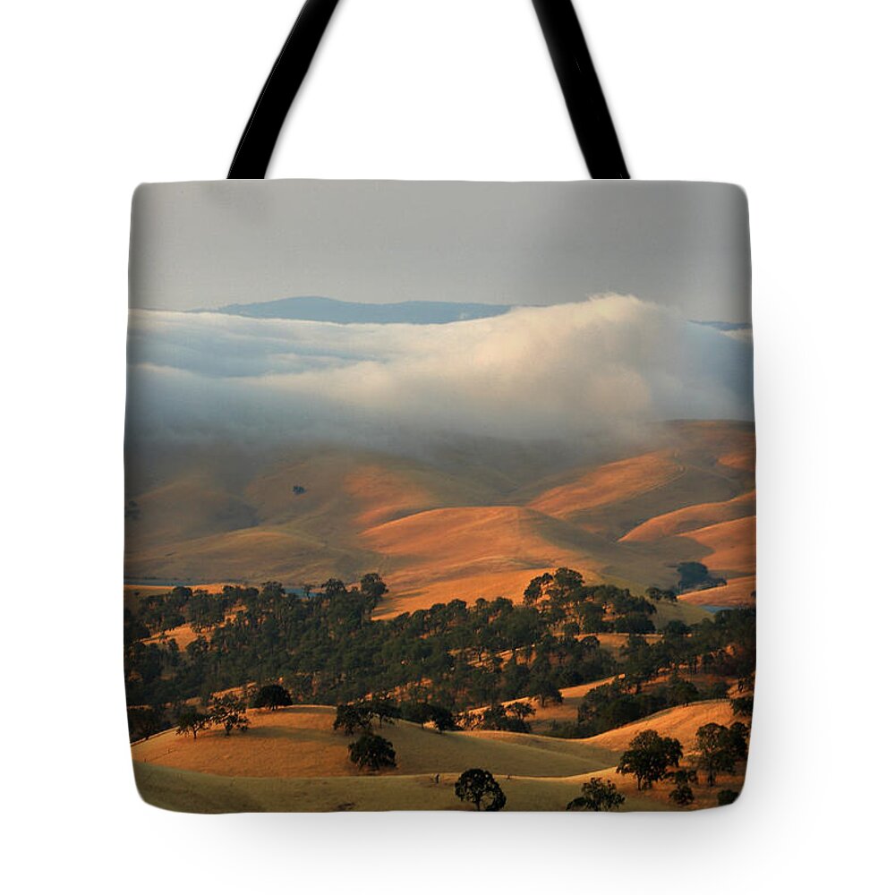 Landscape Tote Bag featuring the photograph Low Clouds Over Distant Hills by Marc Crumpler