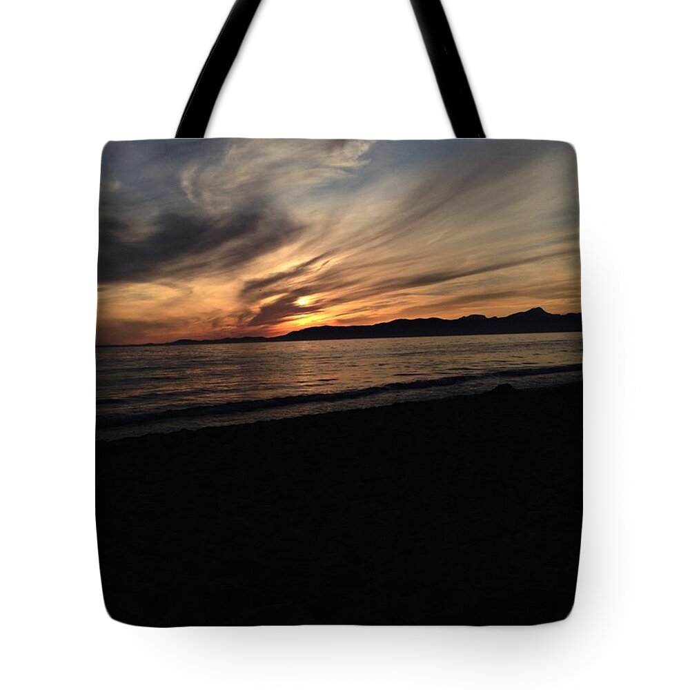 Sunset Tote Bag featuring the photograph Sunset at the beach by Dario Boesch