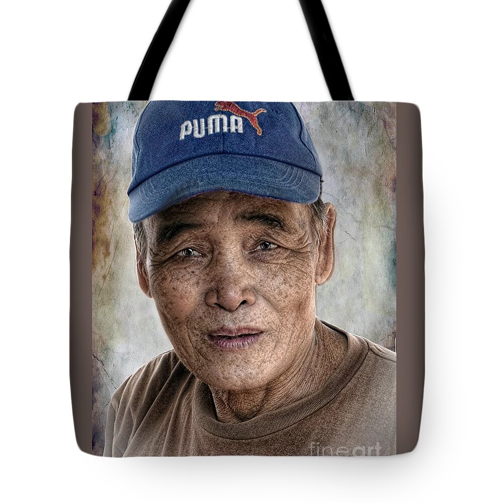 Thailand Tote Bag featuring the digital art Man In The Cap by Ian Gledhill