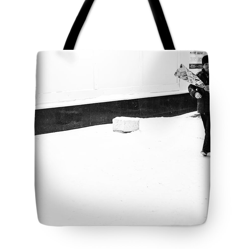 Street Photography Tote Bag featuring the photograph Man in the Snow His Flowers and a Cigarette by John Williams