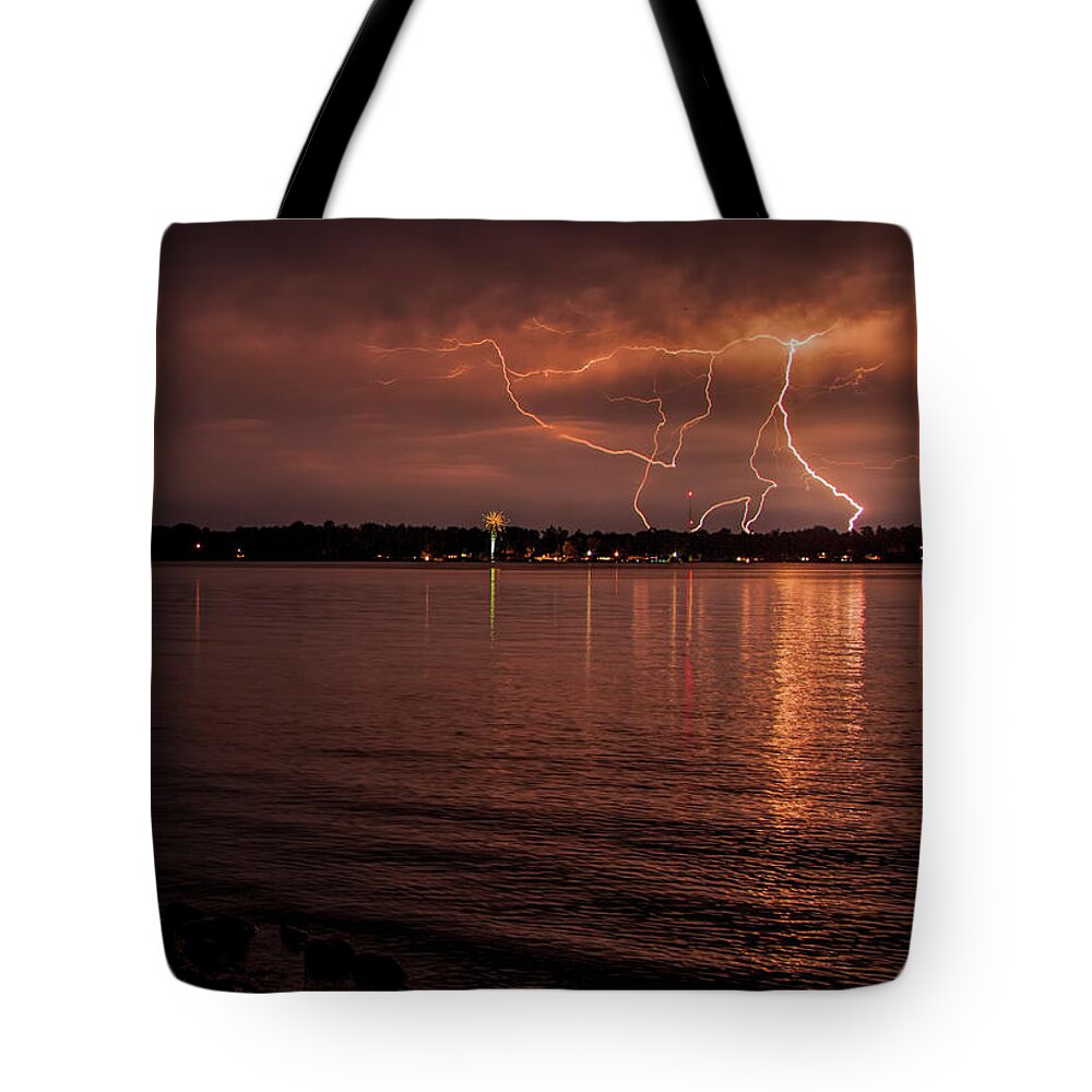 Lightning Tote Bag featuring the photograph Man made and Natural lightning by John Crothers
