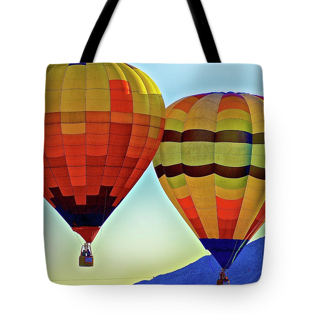 Albuquerque International Balloon Fiesta Tote Bag featuring the photograph Mass Ascension of Balloons 1 by Donald Pash
