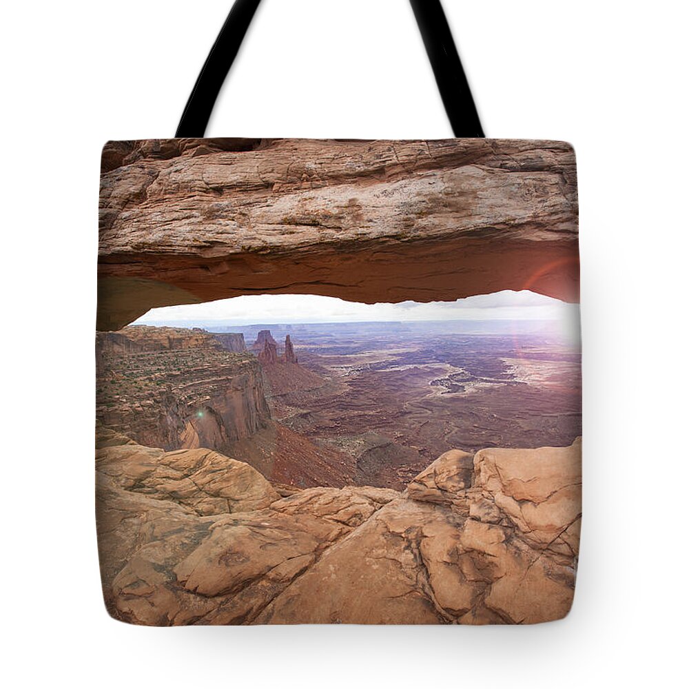 Mesa Arch Tote Bag featuring the photograph Mesa Arch by Timothy Johnson