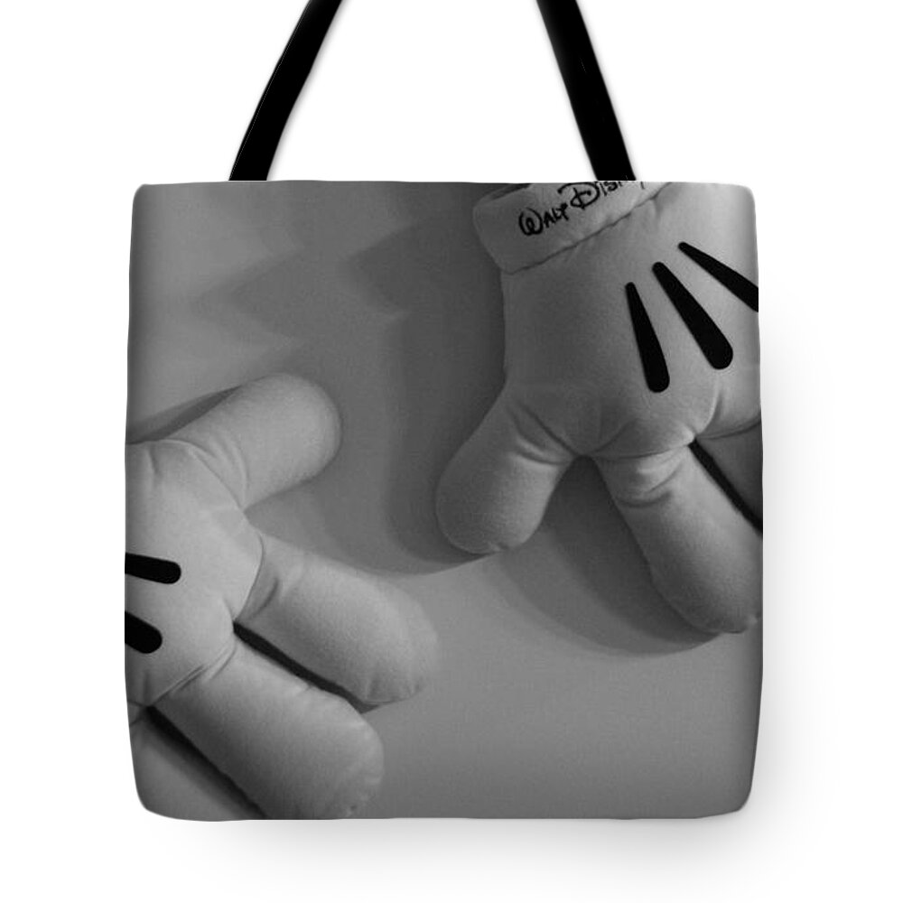 Black And White Tote Bag featuring the photograph Mickeys Hands by Rob Hans