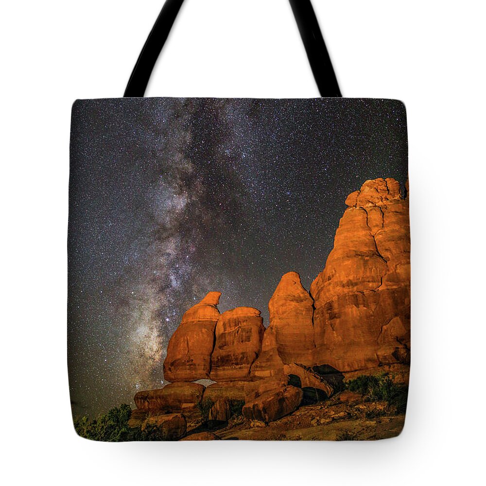 Moab Tote Bag featuring the photograph Milky Way and Navajo Rocks by Dan Norris