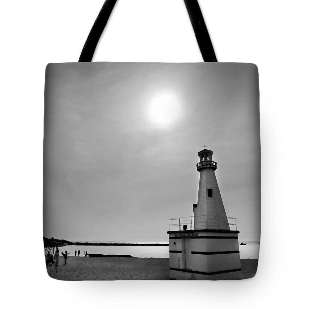 Beach Tote Bag featuring the photograph Miniature Lighthouse by John Hansen