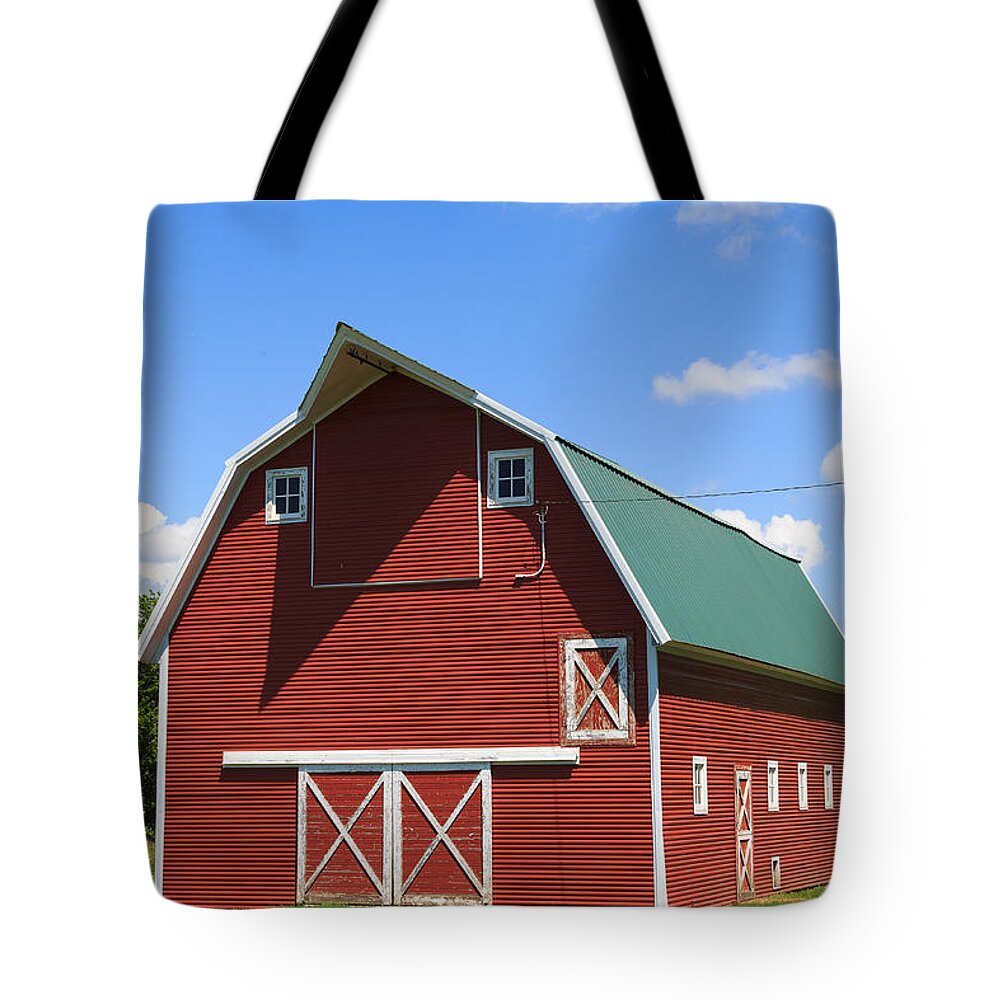 This Beautiful Barn Is Owned By Harold Miller Of Rural Jasper Minnesota. How Lovely It Looks With The Beautiful Blue Sky. Tote Bag featuring the photograph Minnesota Barn by Patricia Schaefer