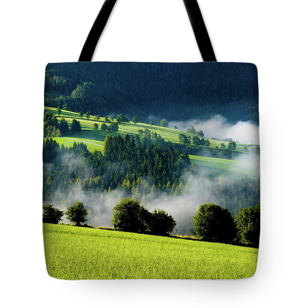 Austria Tote Bag featuring the photograph Misty valley in Austria by Andreas Berthold