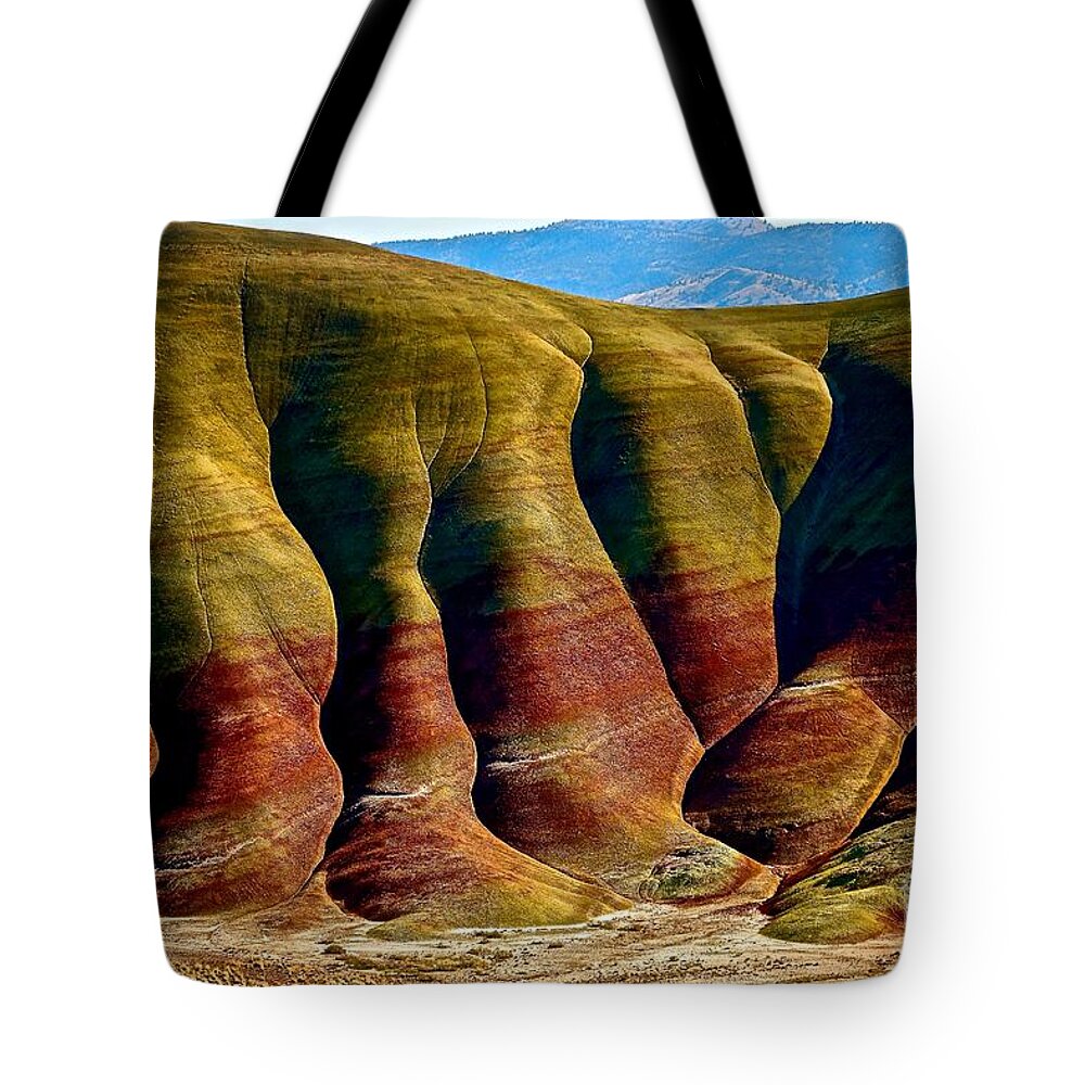 Painted Hills Tote Bag featuring the photograph Molten Hills by Michael Cinnamond