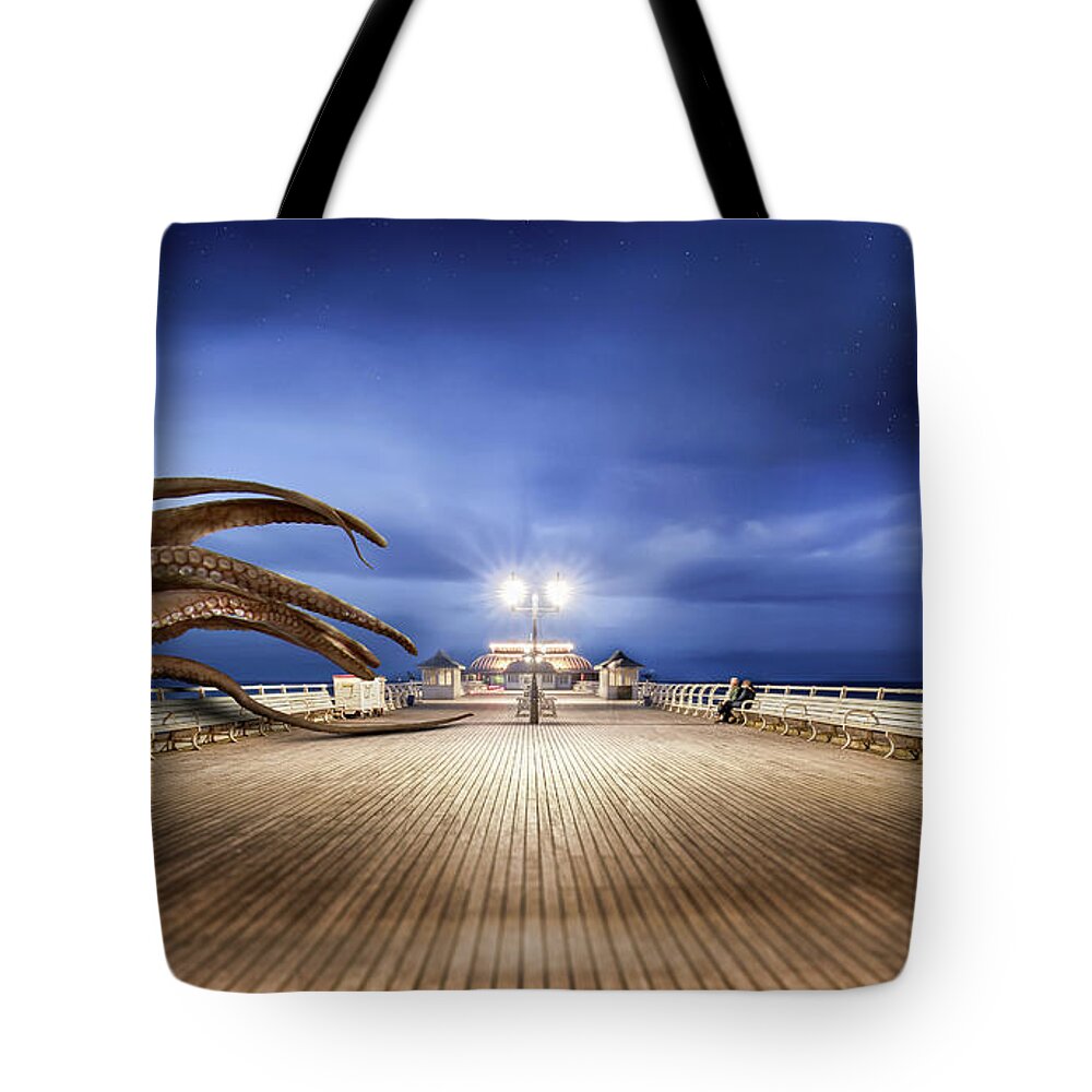 Cromer Tote Bag featuring the photograph Cromer pier Norfolk monster attack by Simon Bratt