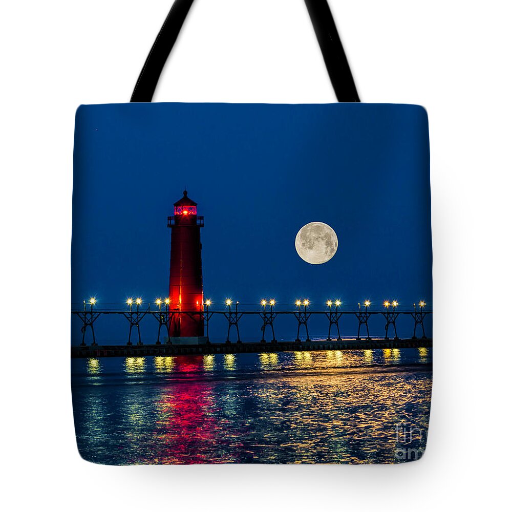 Grand Haven Tote Bag featuring the photograph Moon over Grand Haven by Nick Zelinsky Jr
