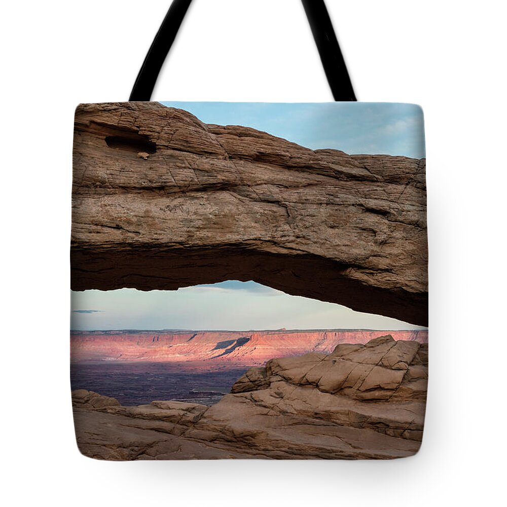 Arch Tote Bag featuring the photograph Moon Over Mesa Arch by Denise Bush