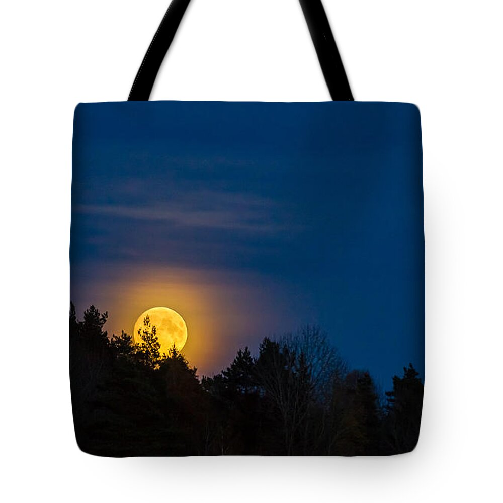 Moon Rise Tote Bag featuring the photograph Moon rise by Torbjorn Swenelius