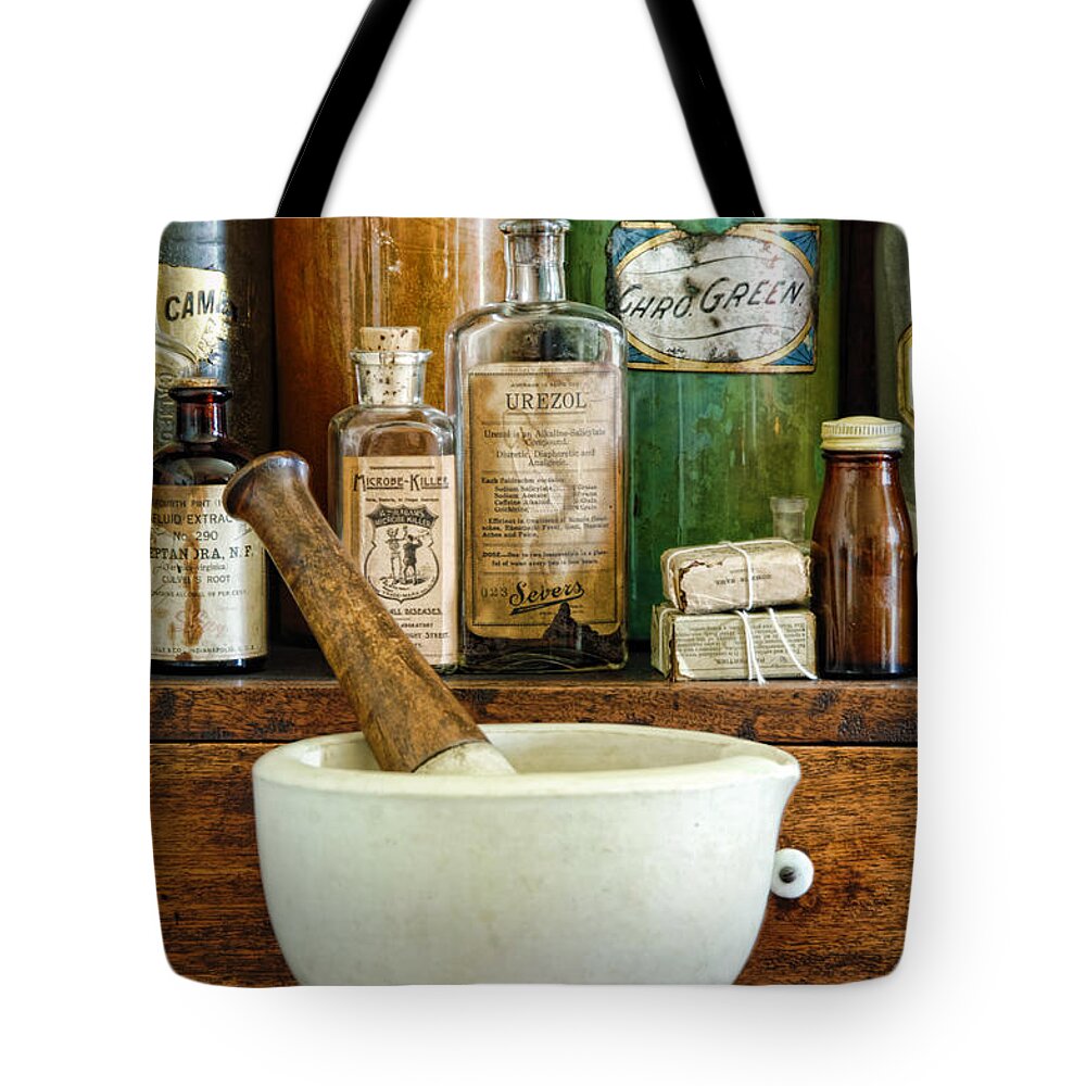 Mortar Tote Bag featuring the photograph Mortar and Pestle by Jill Battaglia