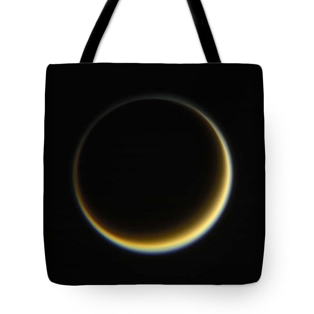 Sun Tote Bag featuring the painting NASA s Cassini spacecraft looks toward the night side of Saturn's moon Titan i by Celestial Images