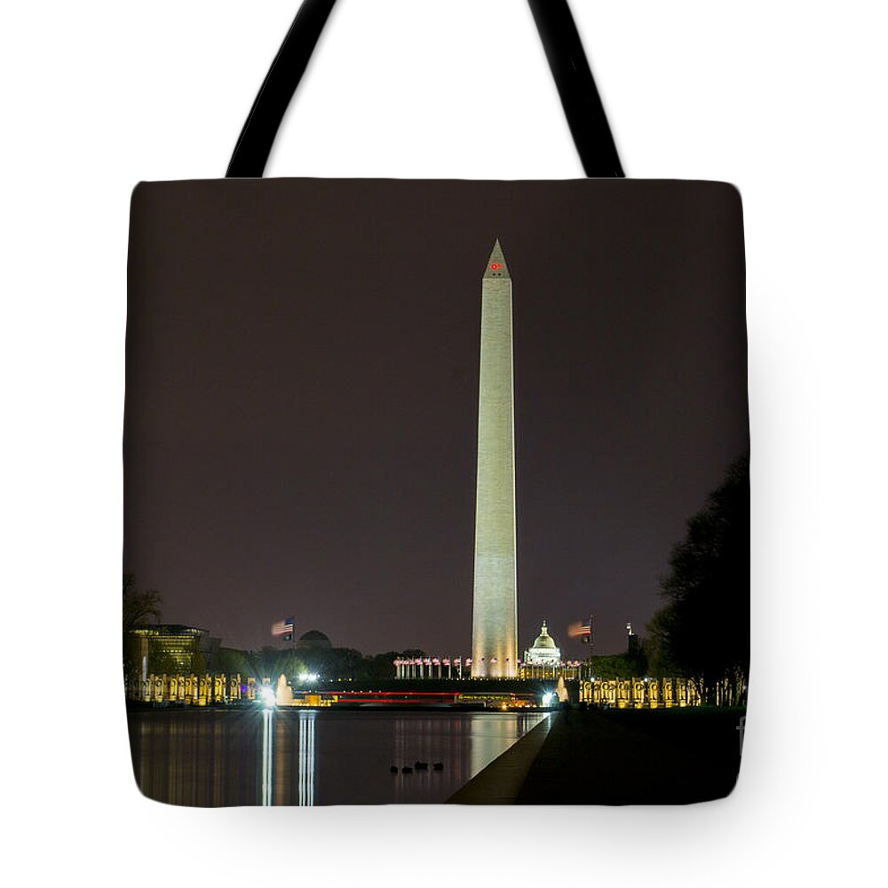 Us Flag Tote Bag featuring the photograph National Mall at Night by Angela DeFrias