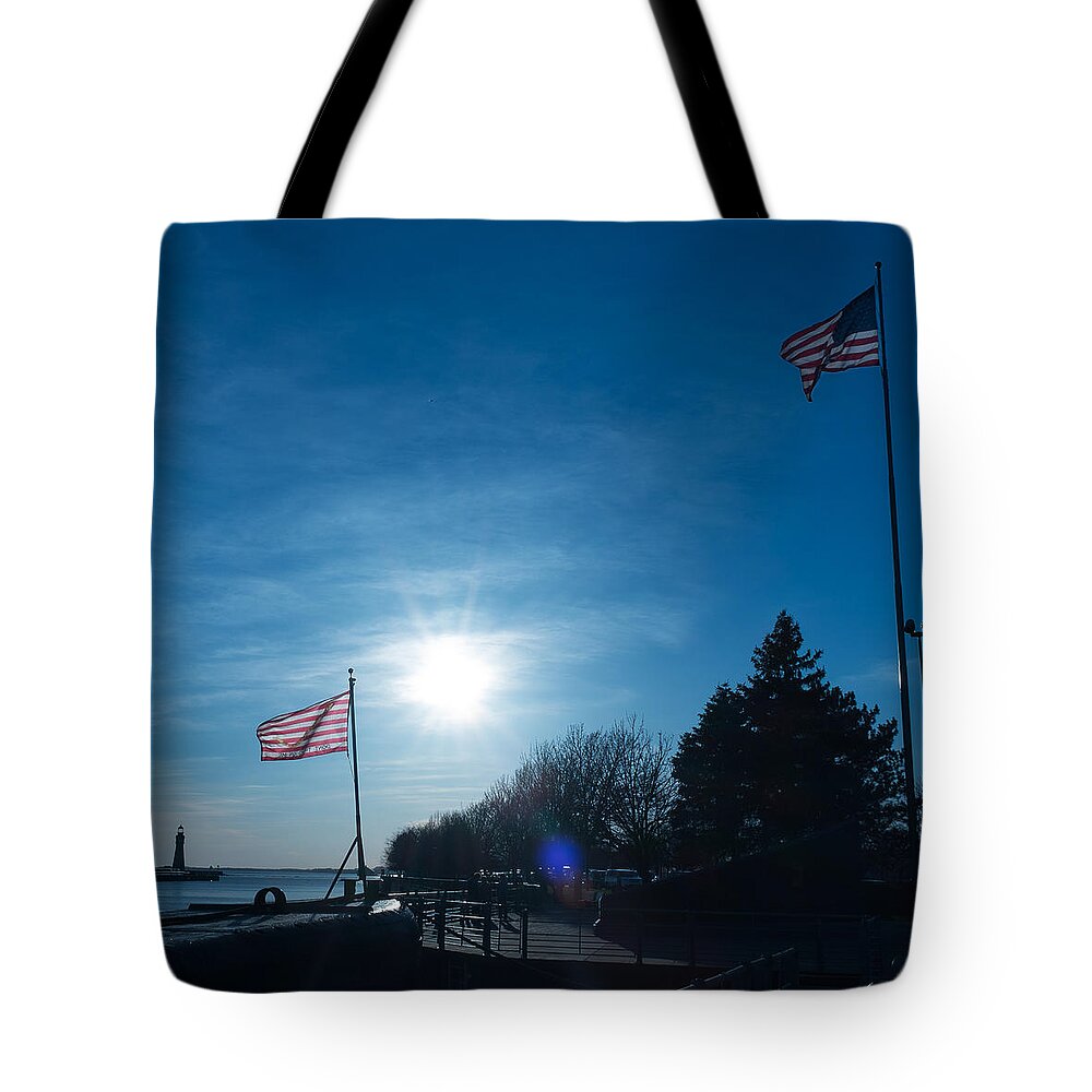 Buffalo Light Tote Bag featuring the photograph Navy Sunset by Chris Bordeleau